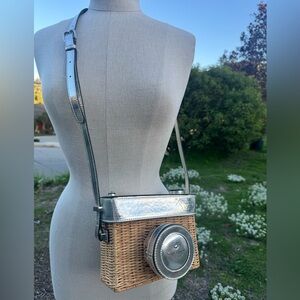 Kate Spade New York Grand Tour wicker camera-shaped bag with silver accents